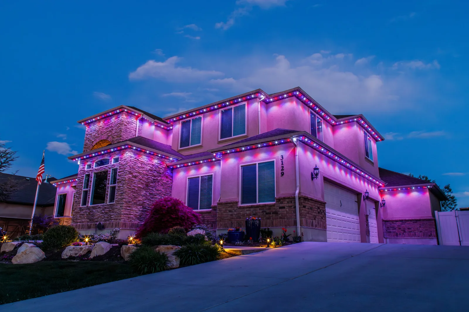 Estate with purple holiday uplighting